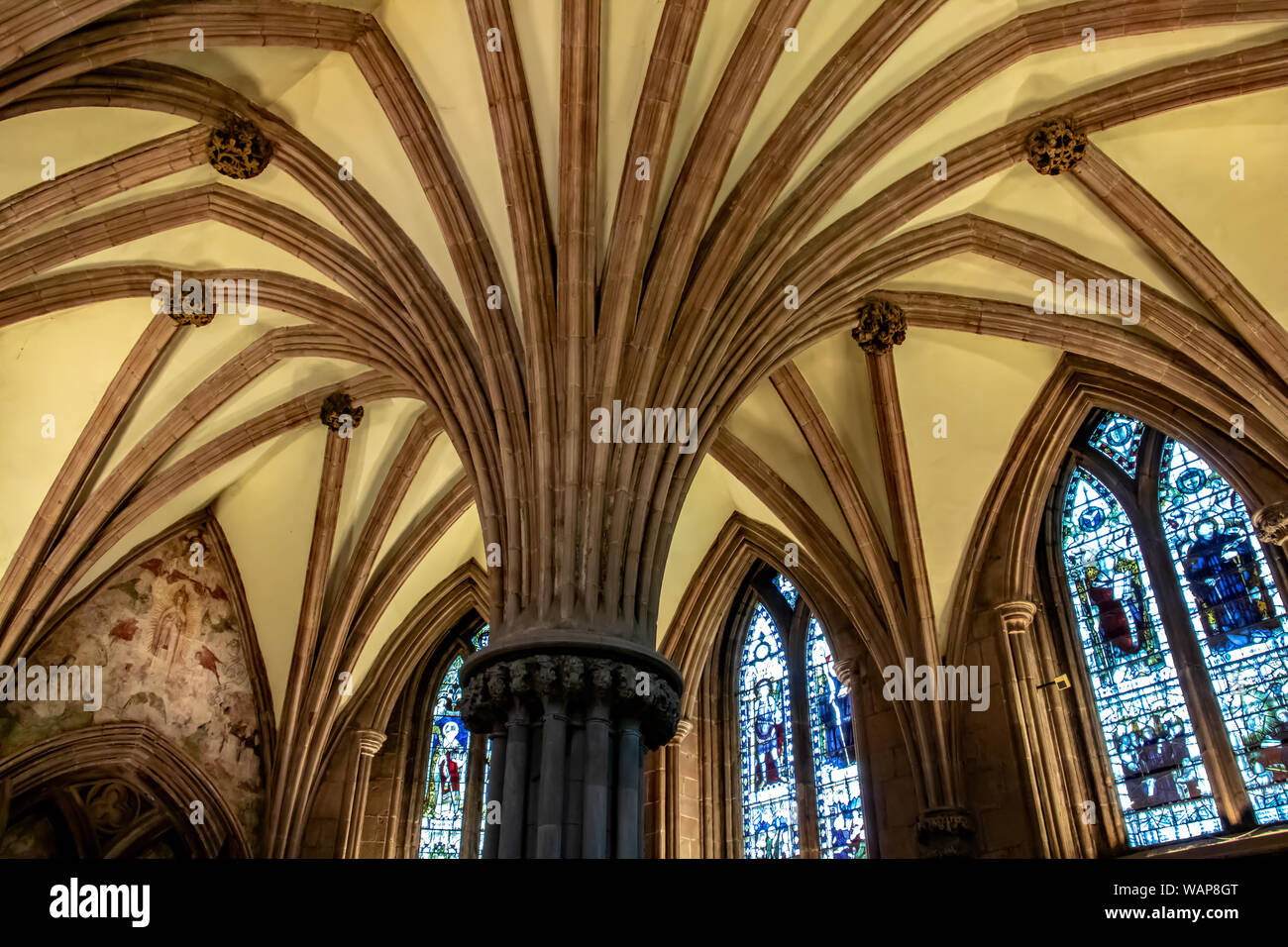 The ceiling and stained glass windows of the Chapter House at Lichfield Cathedral, Staffordshire, England, UK Stock Photo