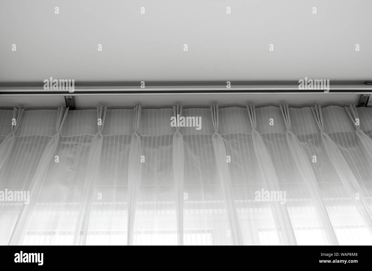 White Tulle On A Rail With A White Ceiling Curtain Interior