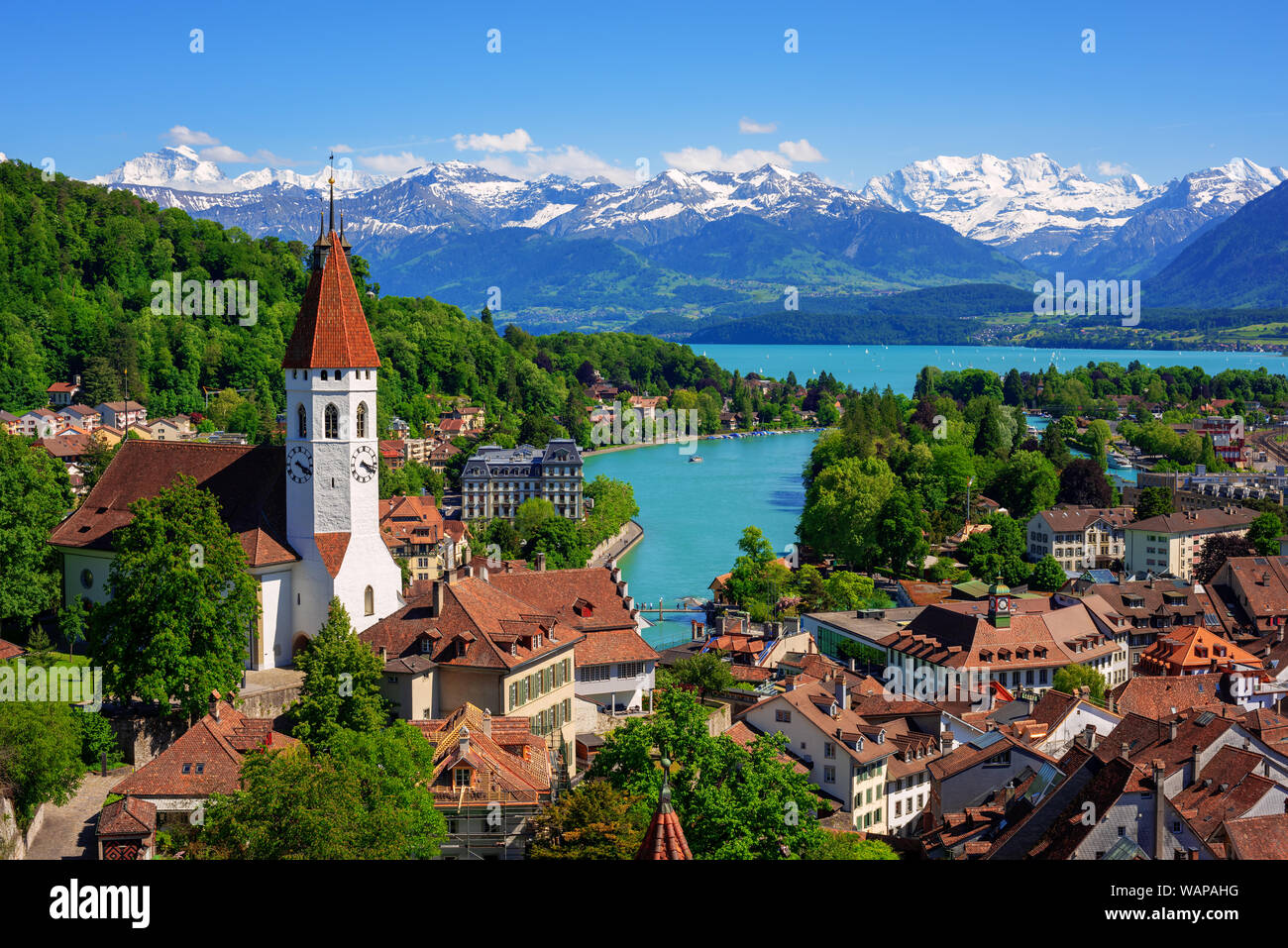 Historical Thun city and lake Thun with snow covered Bernese Highlands swiss Alps mountains in background, Canton Bern, Switzerland Stock Photo
