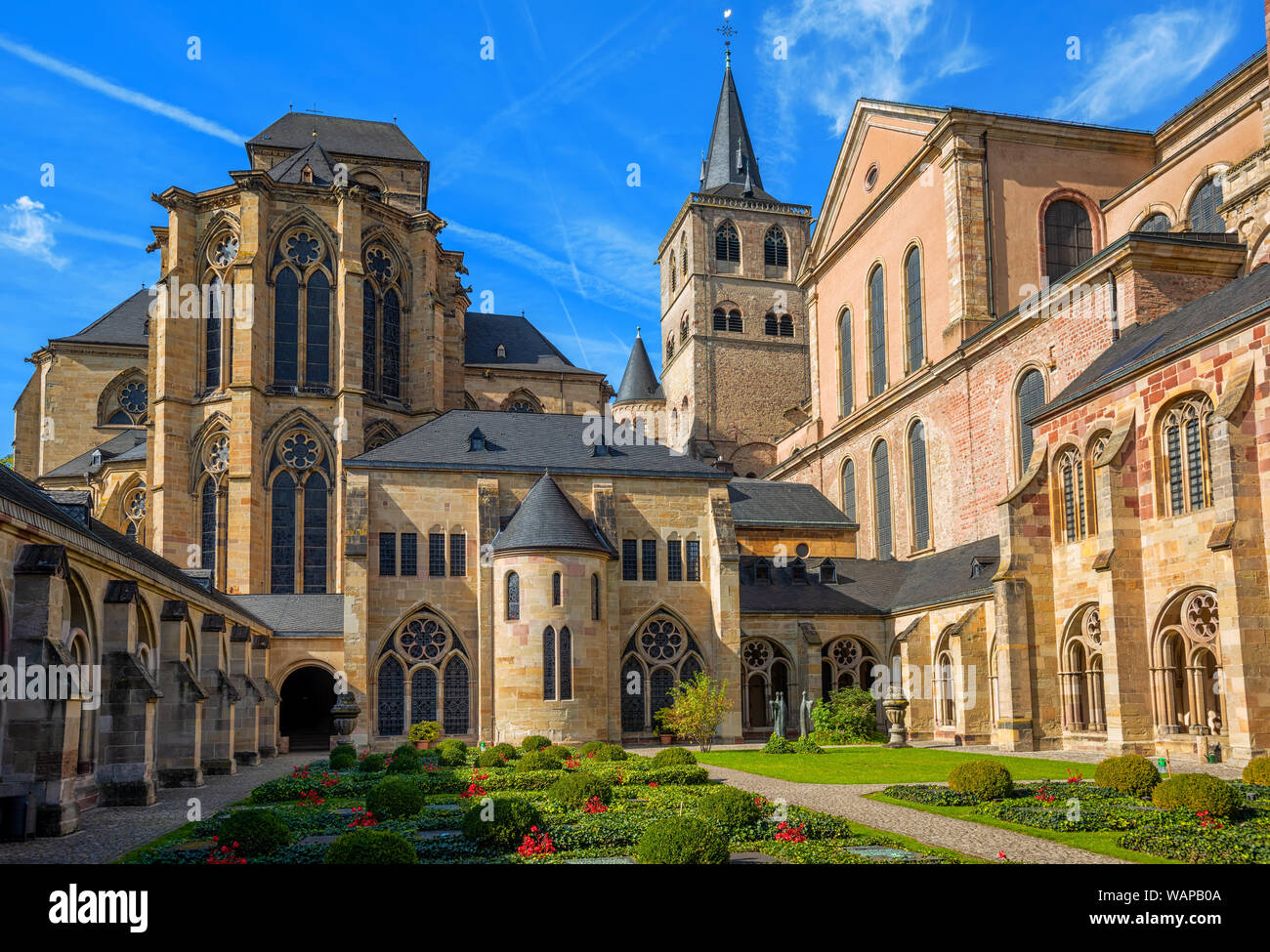 Historical romanesque and gothic style St Peter Cathedral in Trier, Germany, view from the cloister yard. The Cathedral is UNESCO world culture herita Stock Photo