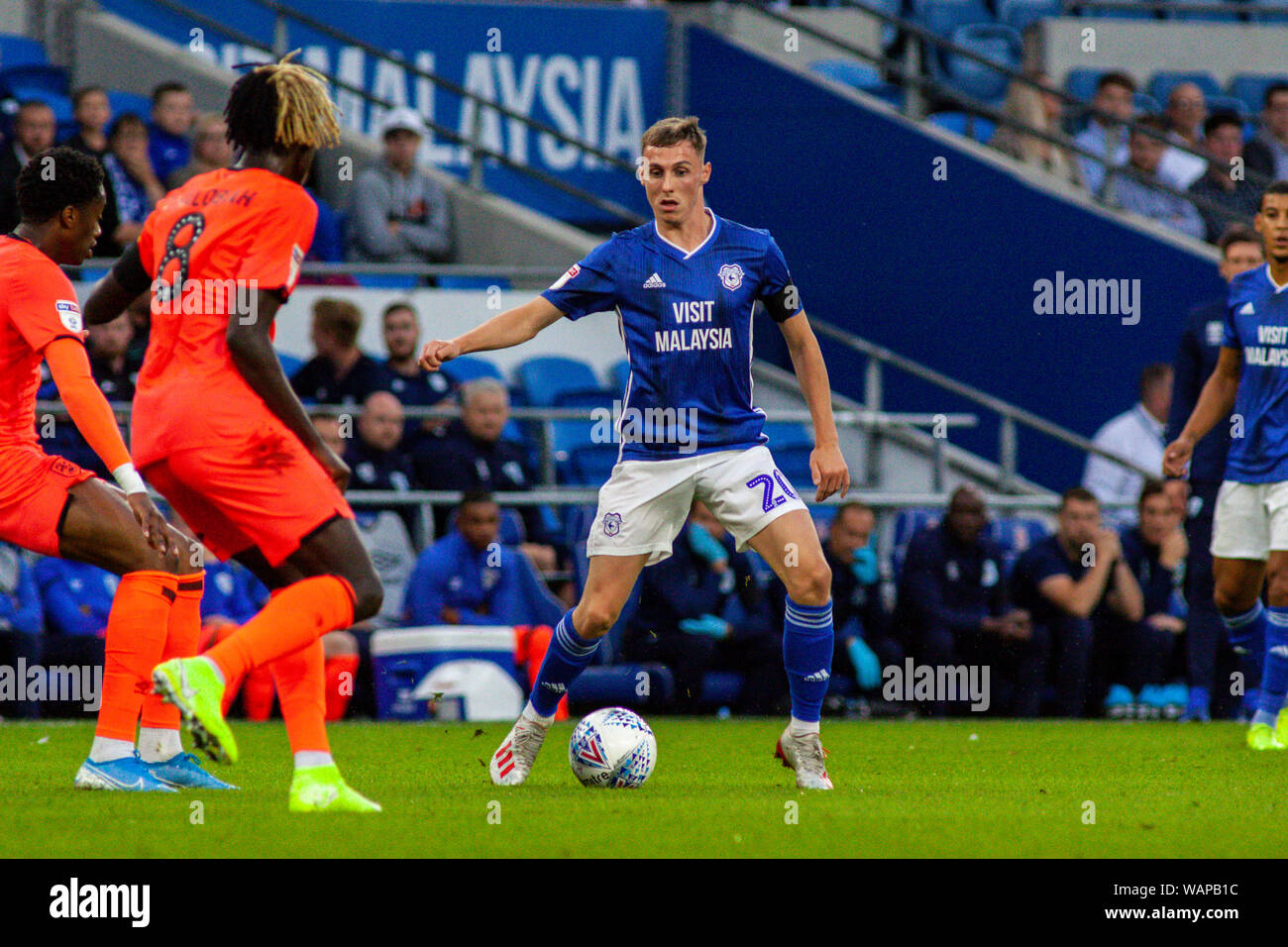 Cardiff, UK. 21st Aug, 2019. Gavin Whyte of Cardiff City (c) in action against Huddersfield Town. EFL Skybet championship match, Cardiff City v Huddersfield Town at the Cardiff City Stadium on Wednesday 21st August 2019. this image may only be used for Editorial purposes. Editorial use only, license required for commercial use. No use in betting, games or a single club/league/player publications. pic by Lewis Mitchell/Andrew Orchard sports photography/Alamy Live news Credit: Andrew Orchard sports photography/Alamy Live News Stock Photo
