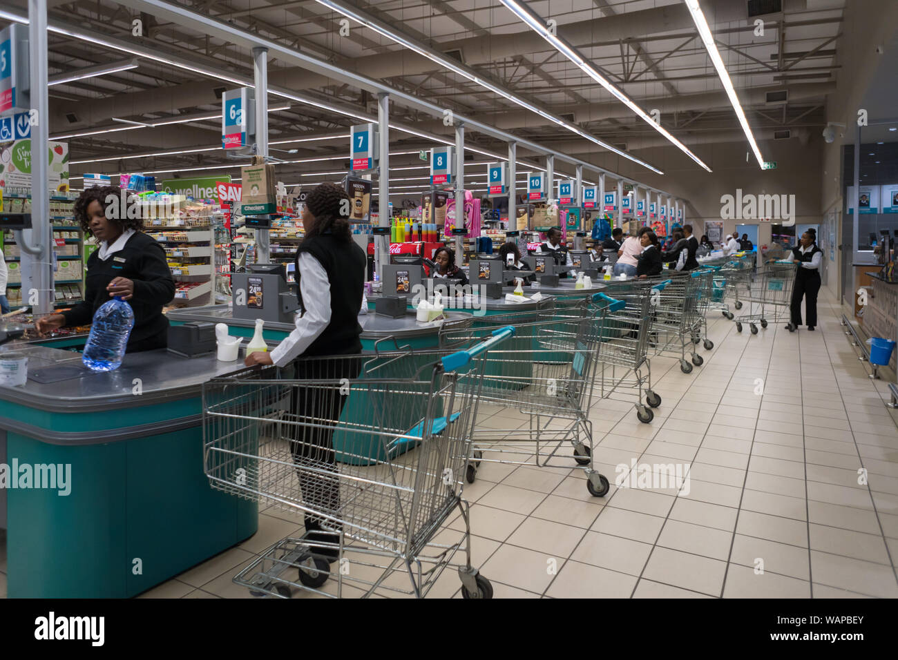 Interior of an African supermarket with many cash pay points or till points and people in Hazyview, Mpumalanga, South Africa concept Africa retailer Stock Photo