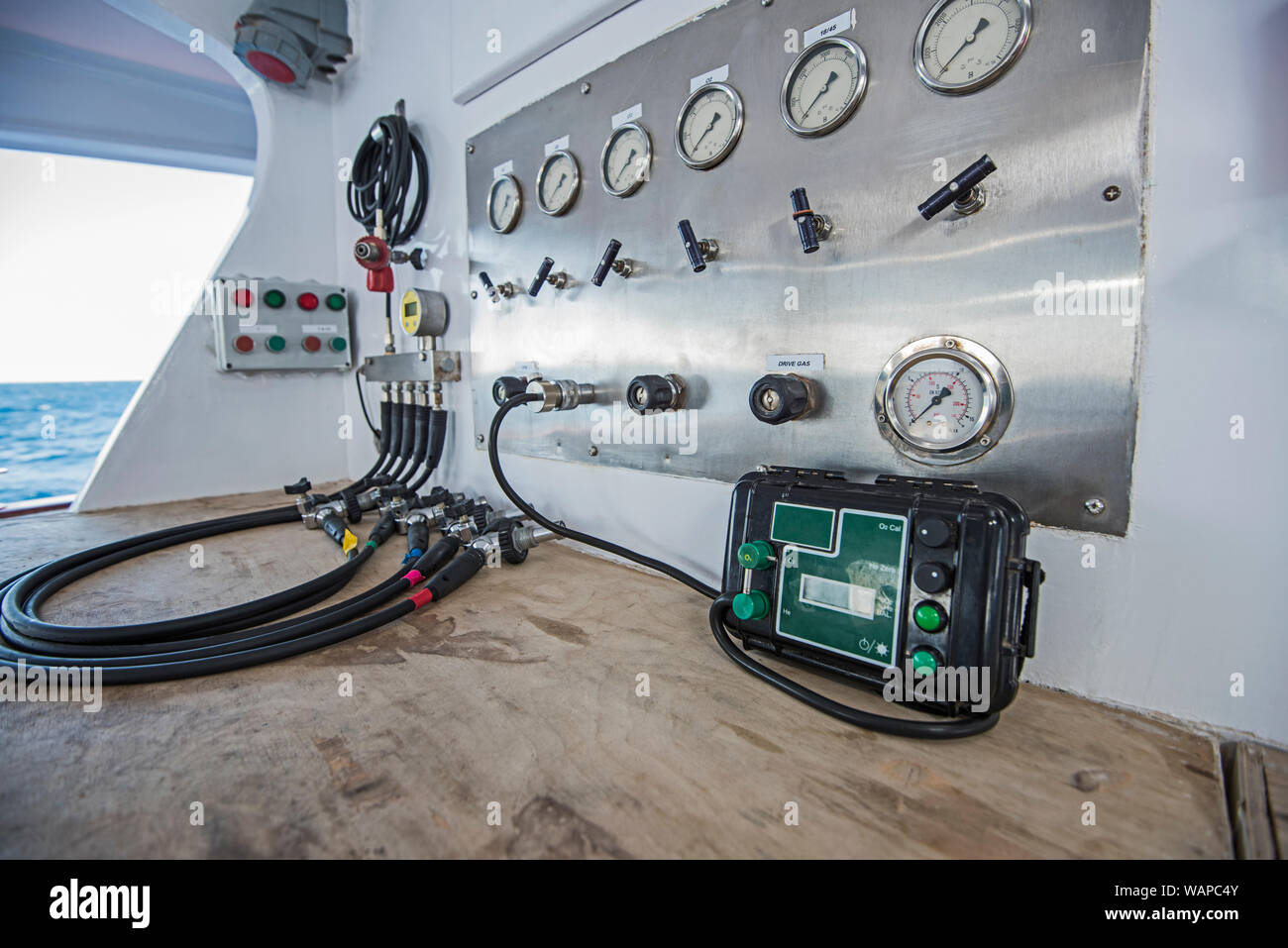 Closeup of industrial trimix gas blending mixing panel with hoses
