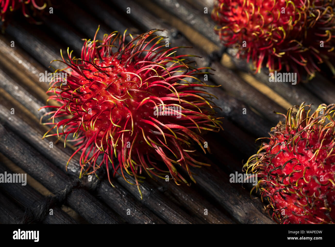 Raw Red Organic Rambutan Fruit Ready to Eat Stock Photo - Alamy