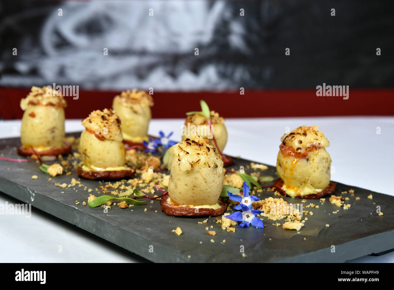 potato stuffed with meat and cheese au gratin Stock Photo