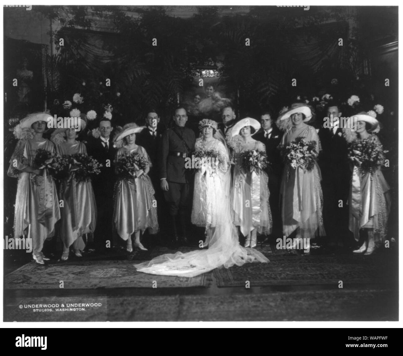 David St. Pierre Gaillard and his wife Mona Blodgett Gaillard. Full-length, standing; with their wedding party Stock Photo
