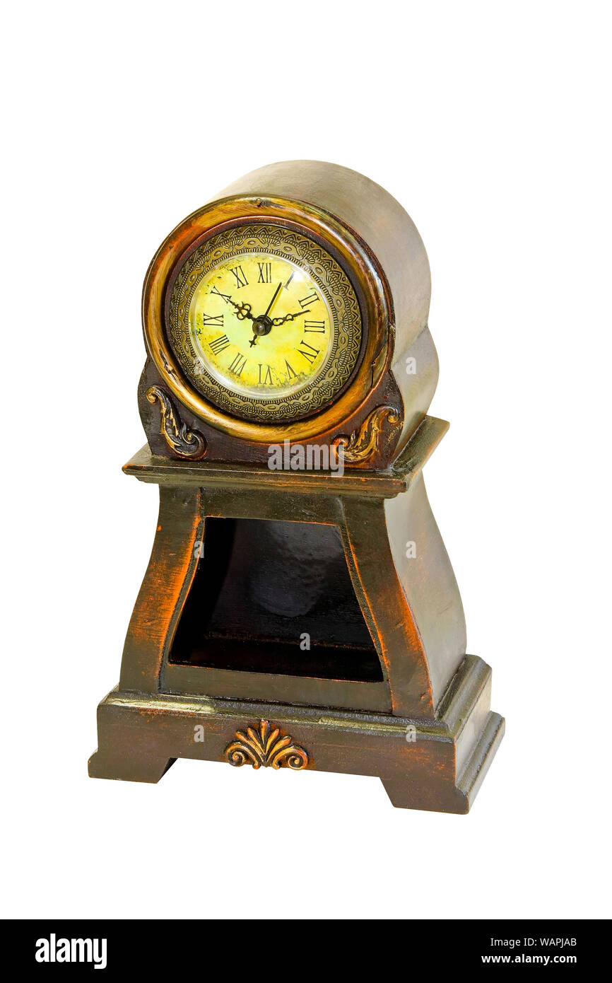Old tabletop clock isolated included clipping path Stock Photo - Alamy