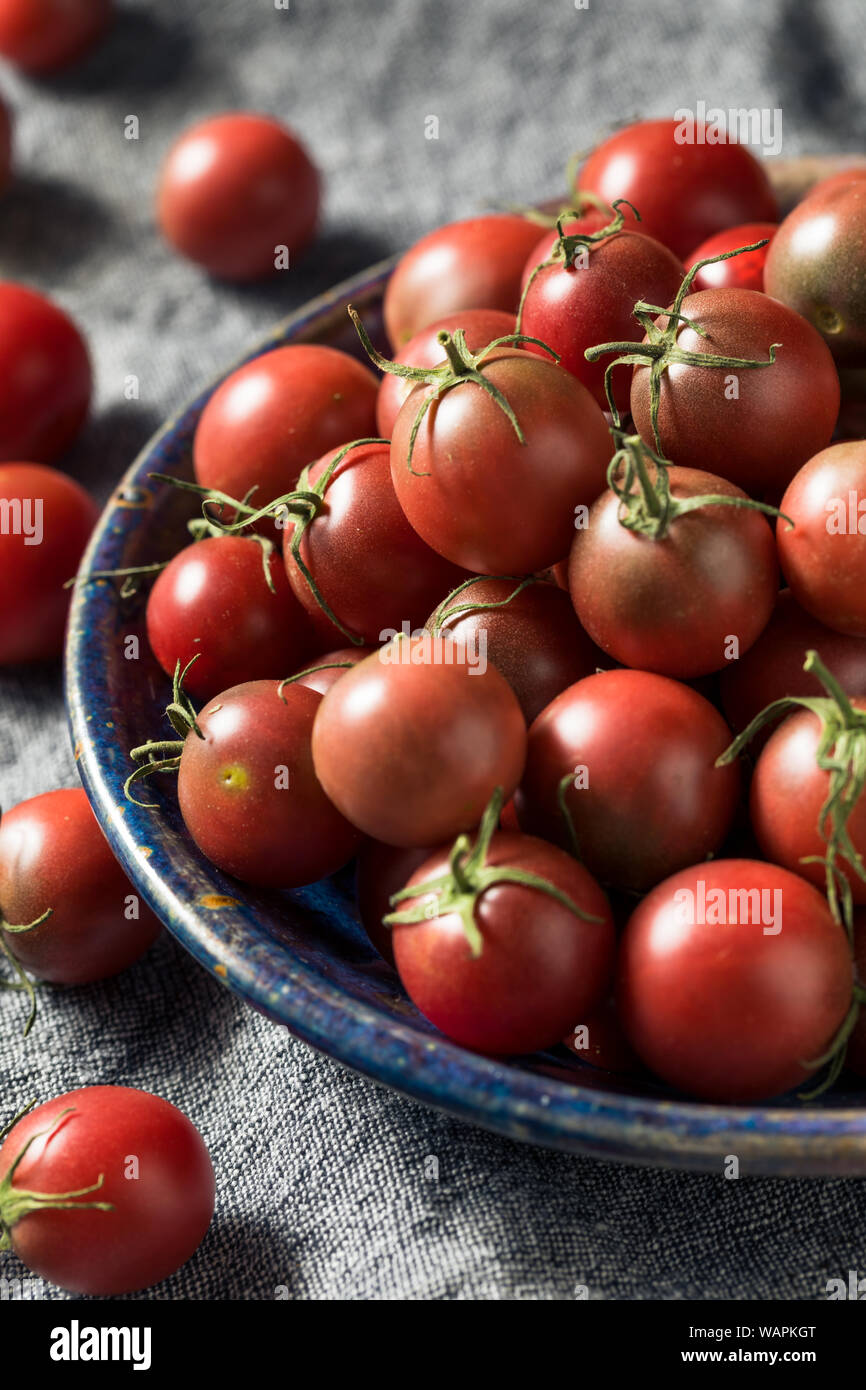 Raw Red Heirloom Cherry Tomatoes in a Bowl Stock Photo - Alamy