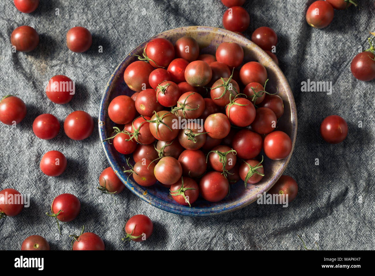 Raw Red Heirloom Cherry Tomatoes in a Bowl Stock Photo - Alamy