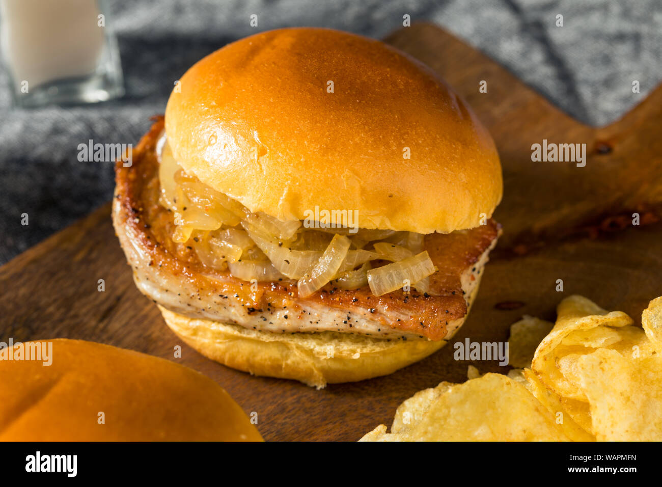 Homemade Chicago Pork Chop Sandwich with Grilled Onions Stock Photo