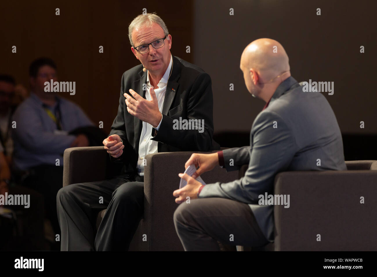 Cologne, Germany, Deutschland, 21.08.2019, Gamescom Congress: MEP Axel Voss (CDU, L) talks to author and presenter Daniel Finger on the podium. Stock Photo