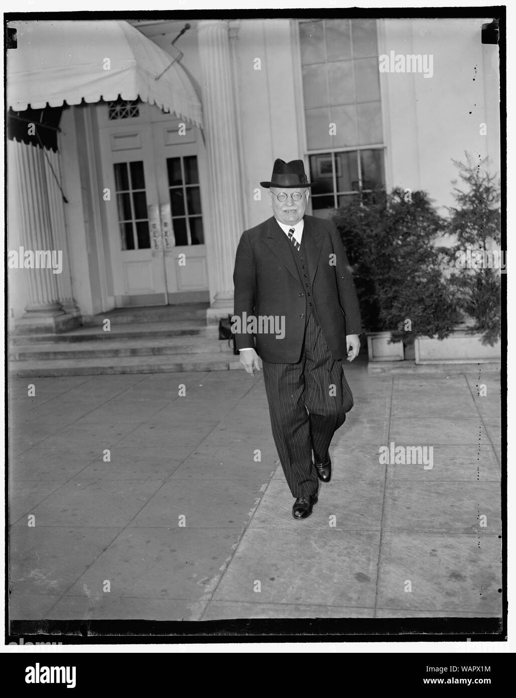 Departing German ambassador bids president goodbye. Washington, D.C., April 22. Dr. Hans Luther, who is being relieved as German Ambassador to the United States, leaving the White House today as bidding goodbye to President Roosevelt, 4/22/1937 Stock Photo