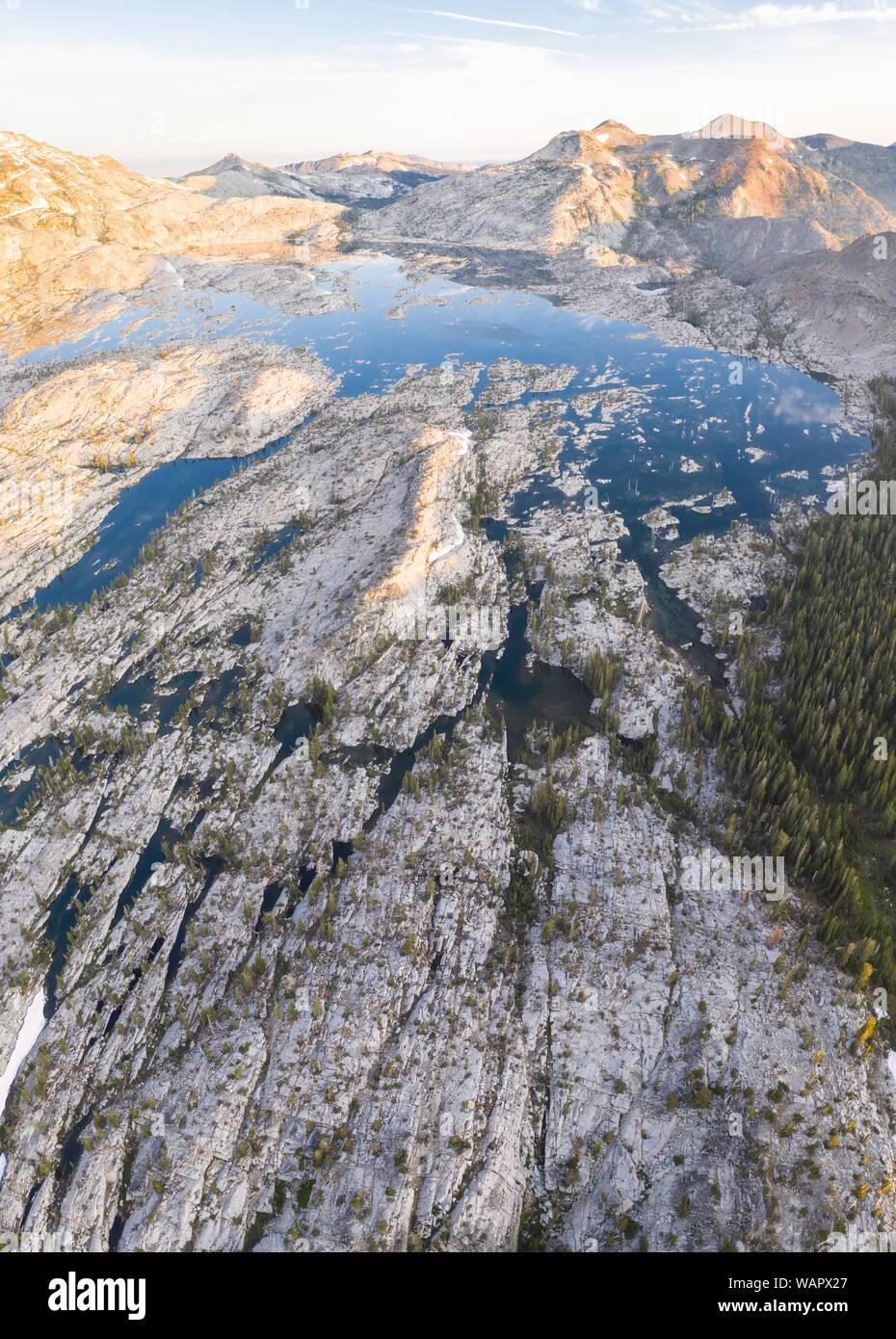 The scenic Sierra Nevada mountain range in California is made up of 100 million year old granite that were sculpted by glaciers over geologic time. Stock Photo