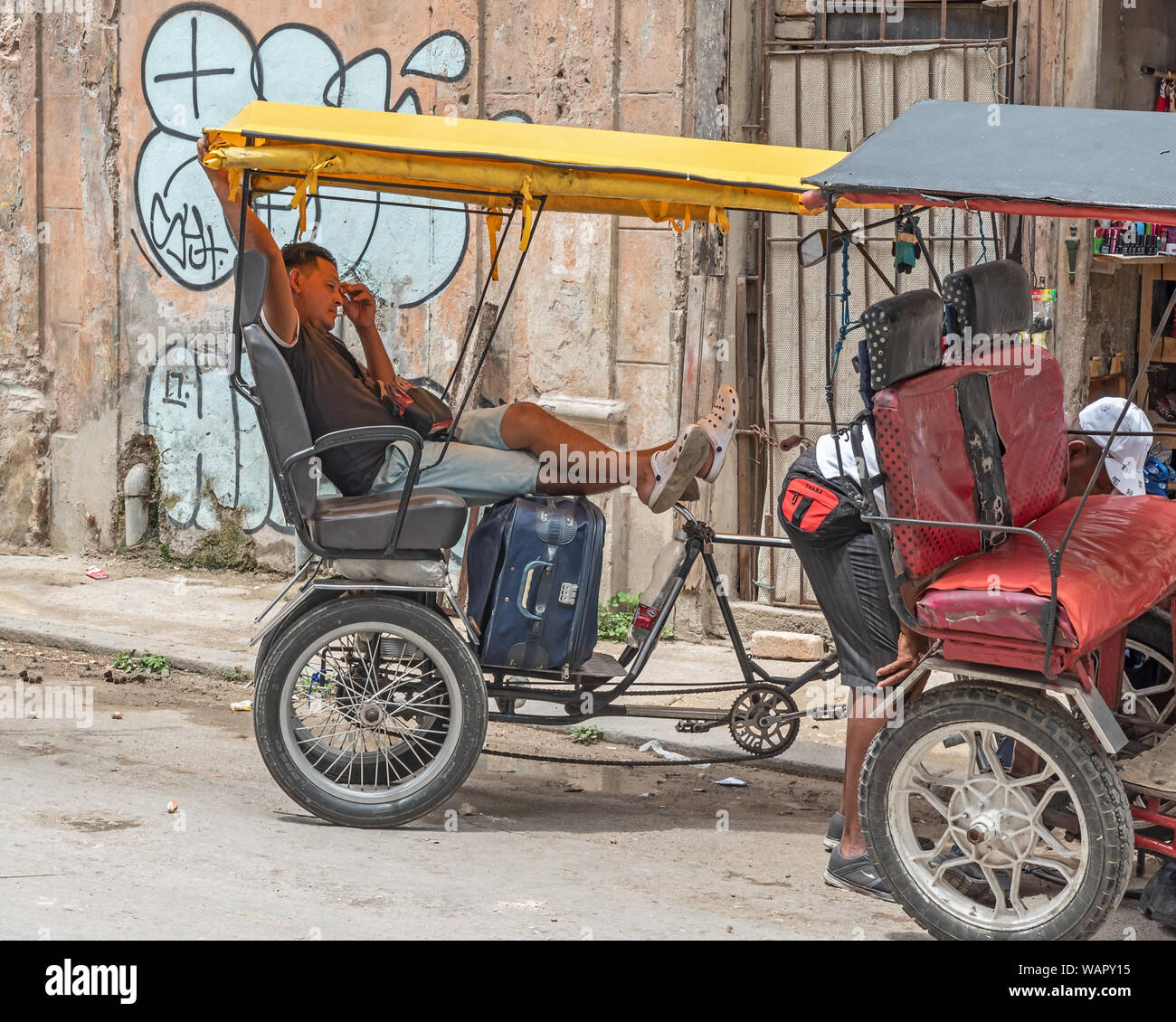 Havana, Cuba - April 09, 2019:  a pedal taxi on a street in the old town of Havana Stock Photo
