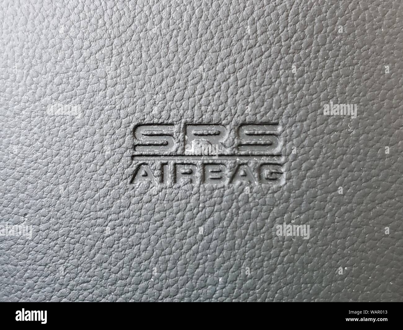 Close-up of logo for SRS Airbag or Supplemental Restraint System airbag, on car dashboard, August 21, 2019. () Stock Photo
