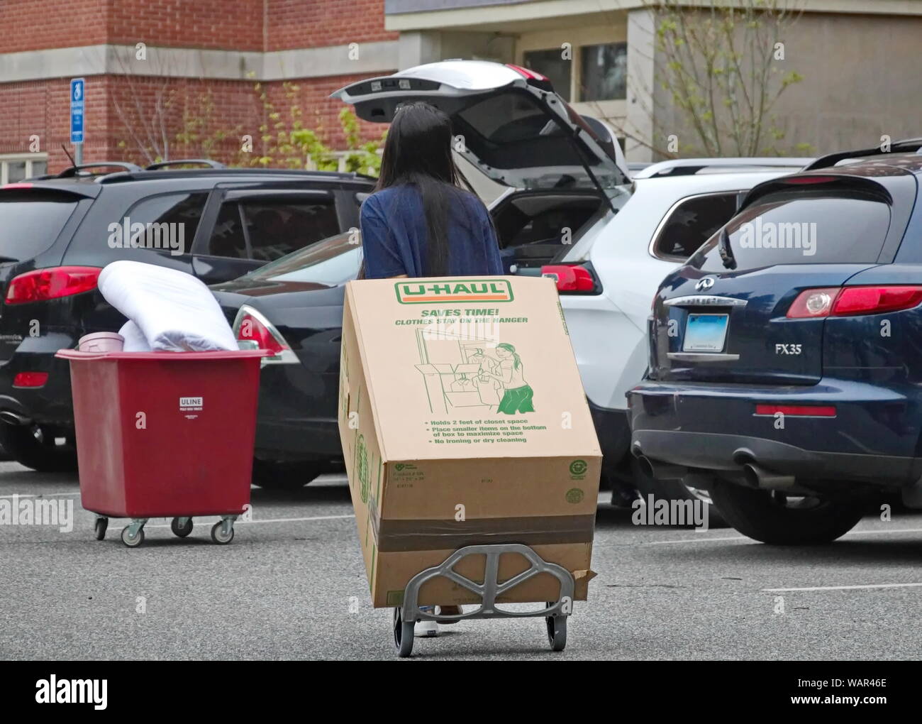 Storrs, CT / USA - May 10, 2019: A college student moves out of the dorm Stock Photo