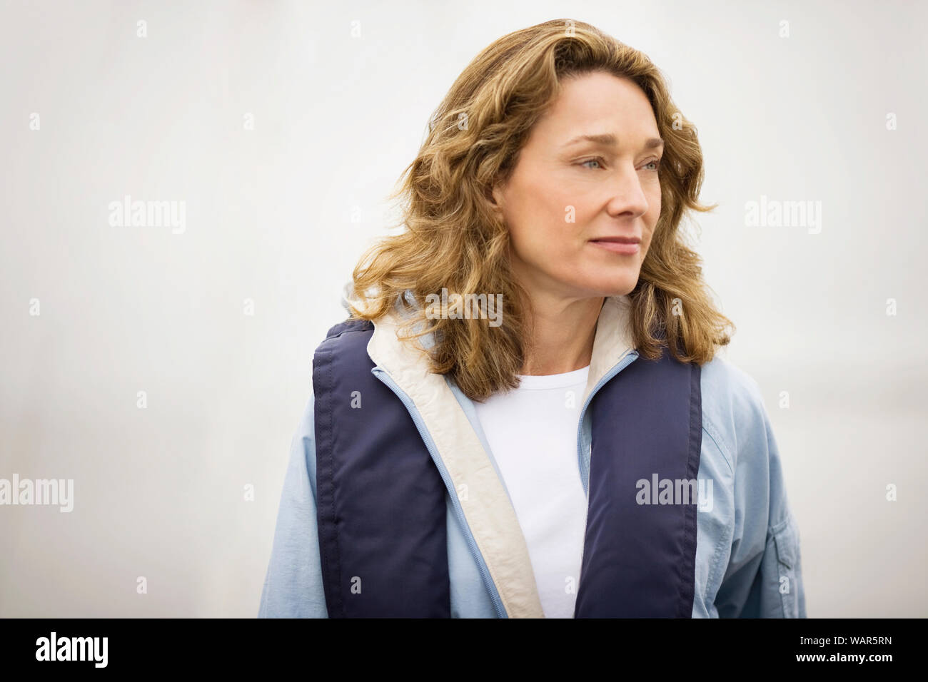 Mature woman standing outdoors hi-res stock photography and images - Alamy