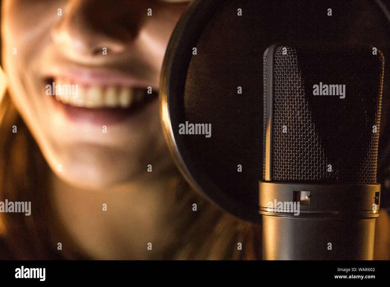Female singer using radio microphone hi-res stock photography and ...