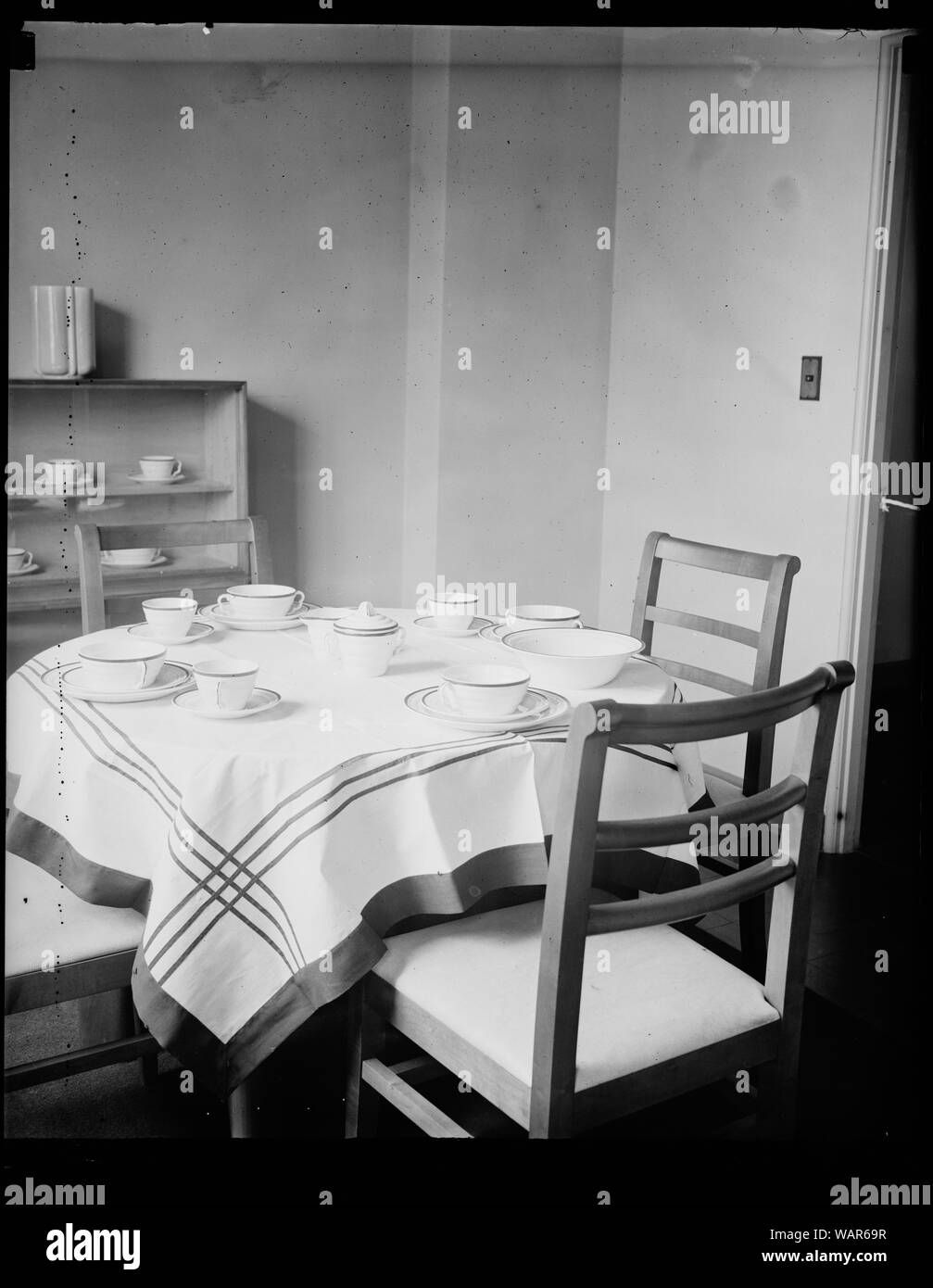 Dining room in RA's low-rent project, Berwyn Heights, MD, Sept. 30. The dining room of the first completed unit of the Resettlement Administration's planned city at Greenbelt, here. The houses were built to show what could be done in the low-rent housing field Stock Photo