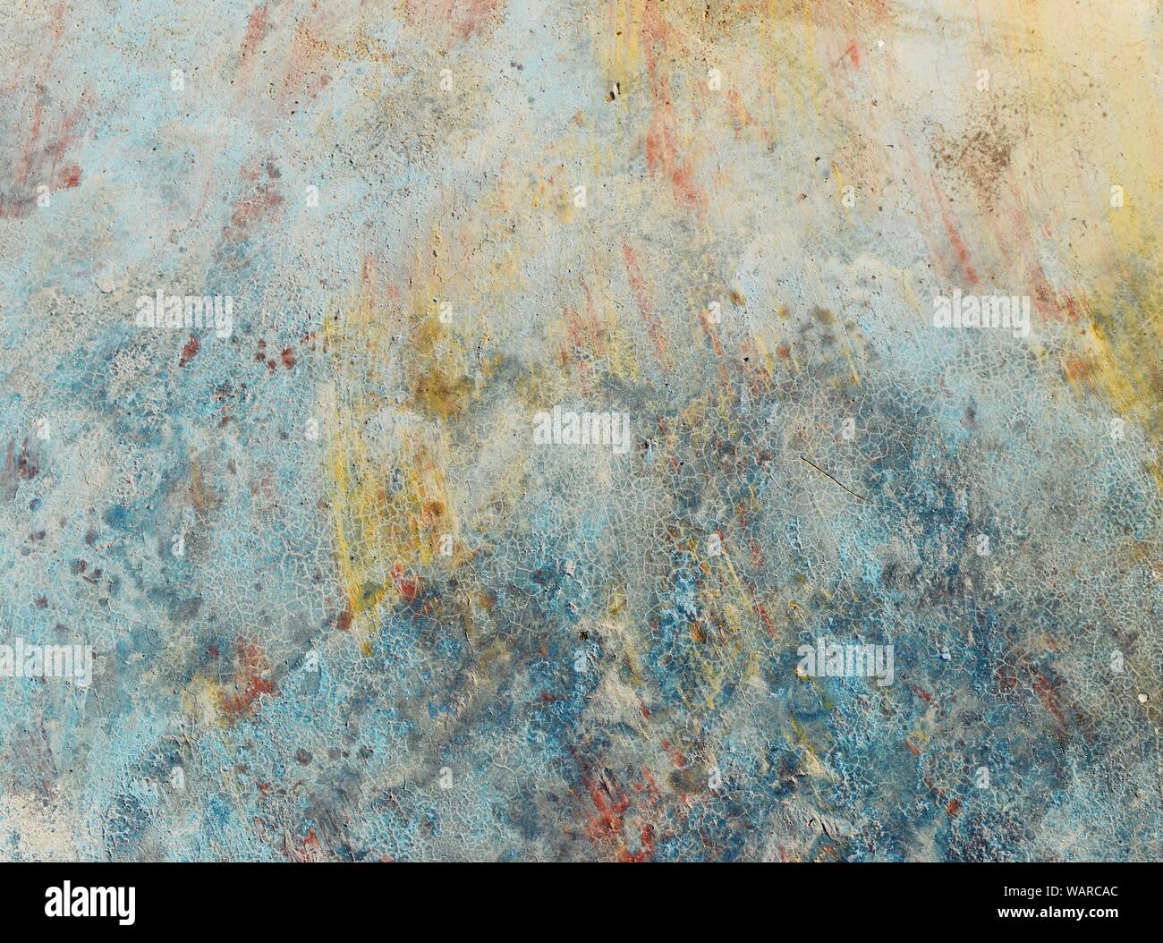 Paint drips and brush marks, Blue with green and yellow on Gray surface Stock Photo