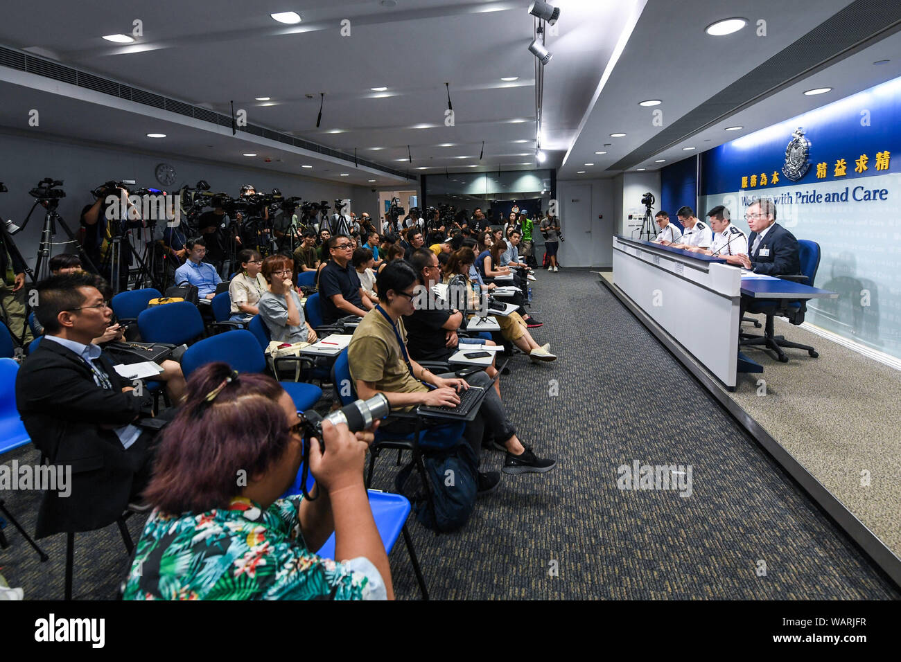 Beijing, China. 21st Aug, 2019. Photo taken on Aug. 21, 2019 shows the scene of a press conference held by Hong Kong police in south China's Hong Kong. Hong Kong police on Wednesday called on all journalists to respect each other's freedom of news coverage after a female reporter from the mainland was surrounded by her Hong Kong peers questioning her identity after a press conference on Tuesday. Credit: Mao Siqian/Xinhua/Alamy Live News Stock Photo