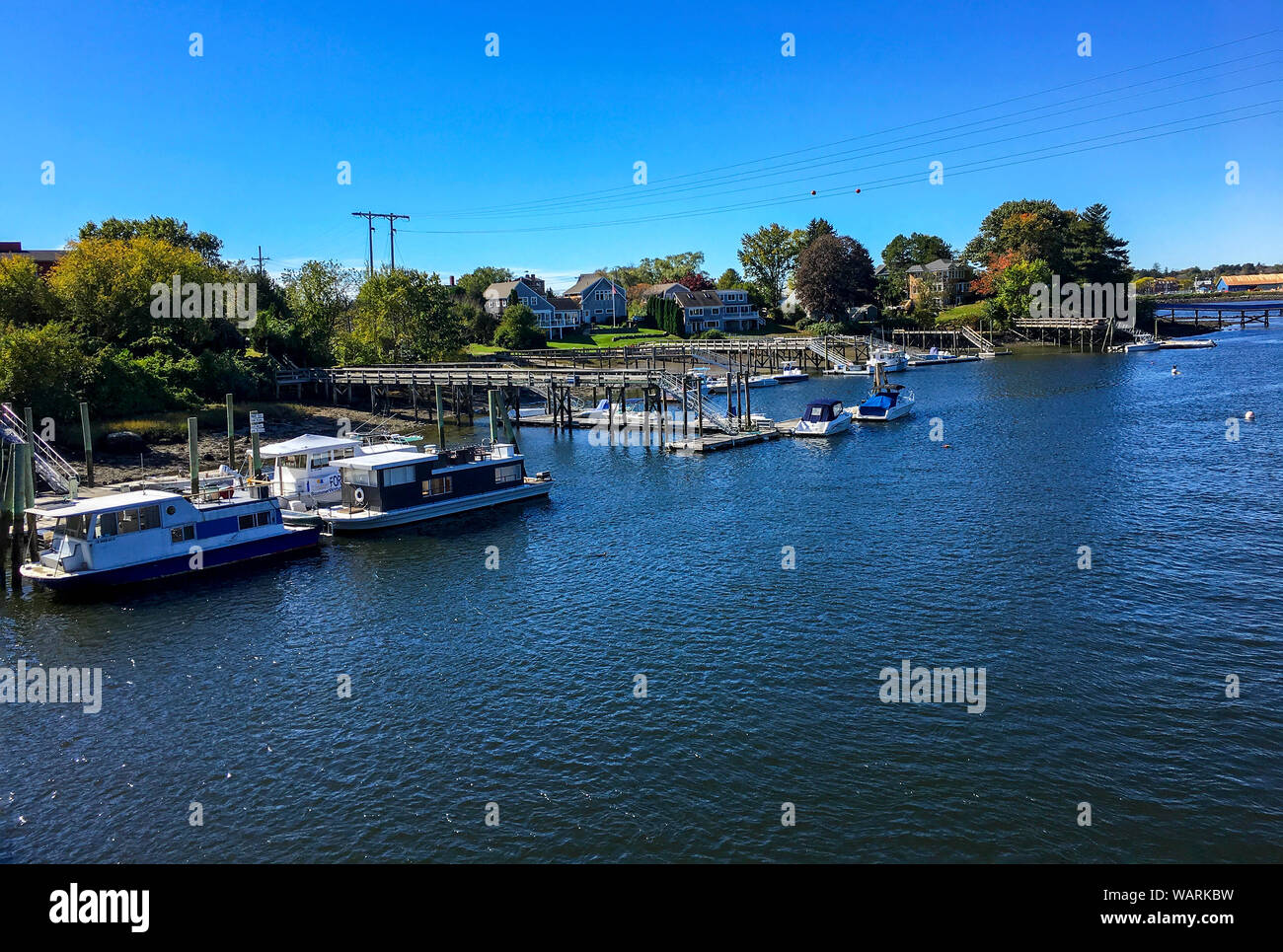 Kittery, Maine / USA - Oct 16 2018: View of the Piscataqua River and Badger's Island taken from Kittery, ME. Docked recreational boats on blue water. Stock Photo