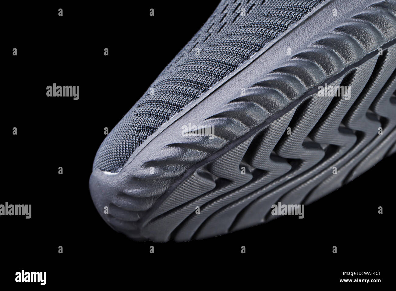 Fragment of a rubber black sole sneaker. Bottom of sports shoes Stock Photo  - Alamy