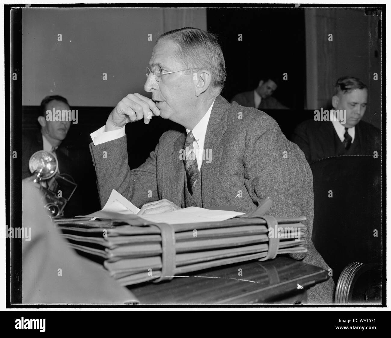 Dupont opposes incentive taxation. Washington, D.C., Dec. 1. Appearing before the Senate Finance Subcommittee investigating profit sharing systems, Lammont DuPont, President of the E.I. DuPont De Nemours Co., today declared his opposition to incentive taxation as an inducement of social management of industry. He said that by careful study he had not been able to discover any practical[?] method for the federal government to introduce any plan of rewards or penalties in the tax system which will promote the exercise of sound business judgment Stock Photo