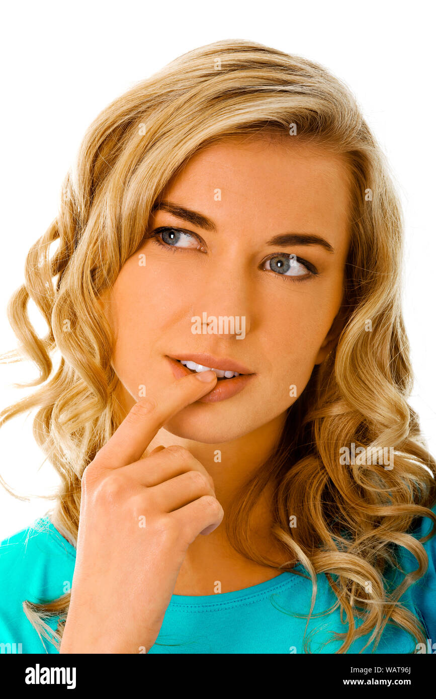 Wondering woman putting finger on mouth while thinking, on white background. Stock Photo