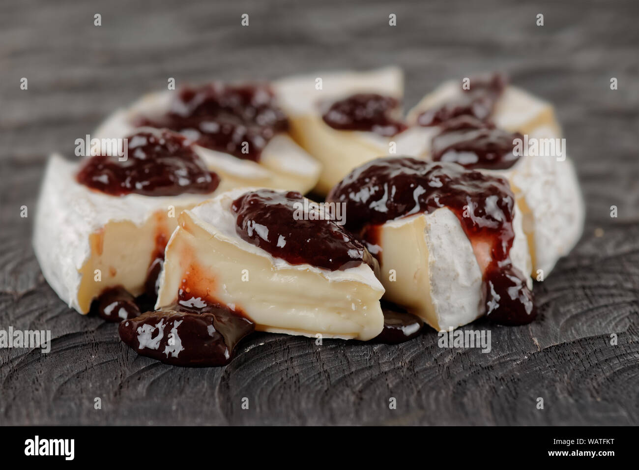 Brie cheese with cherry jam Stock Photo Alamy