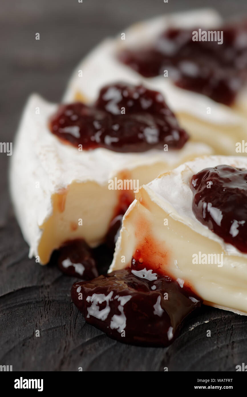 Brie cheese with cherry jam Stock Photo Alamy