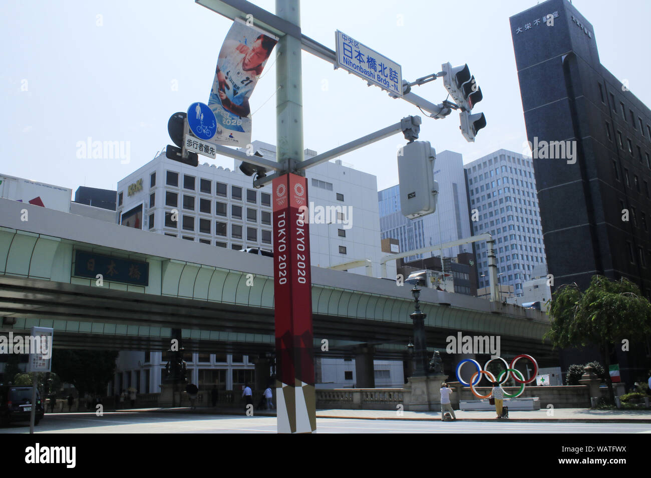The display with portraits of athletes and the Tokyo Olympics and Paralympic logos appear in Tokyo to mark one year away from the Olympics Games 2020. Stock Photo
