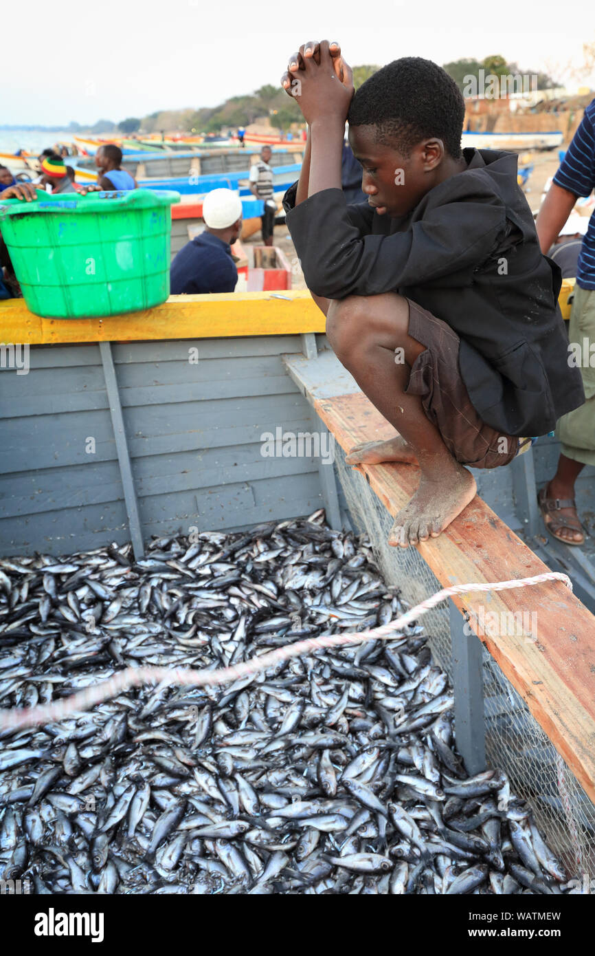 Bare boy lying on his belly on the beach in village of Chembe, Cape  Maclear, Malawi Stock Photo - Alamy