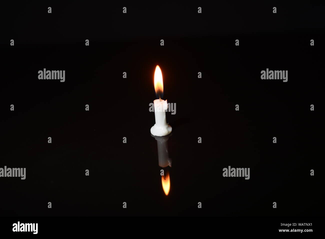 Candle flame close up on a black background Stock Photo - Alamy