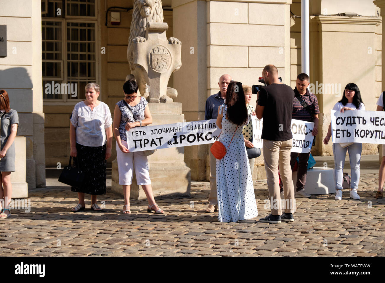 News crew filming protesters regarding a construction company  in Front of Lviv City Hall Stock Photo