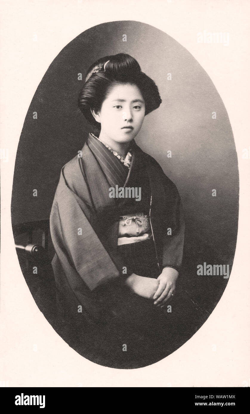 [ 1910s Japan - Japanese Woman in Kimono ] —   19 year old  Japanese woman in kimono. Photograph is dated 1919 (Taisho 8).  20th century vintage gelatin silver print. Stock Photo