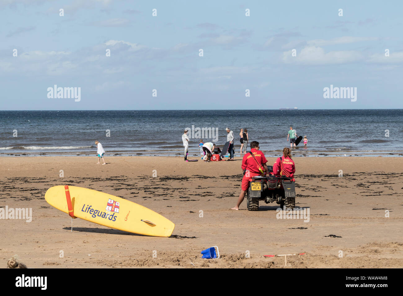RNLI Lifeguards on the Beach at Saltburn-by-the-Sea, Cleveland, North Yorkshire, UK Stock Photo