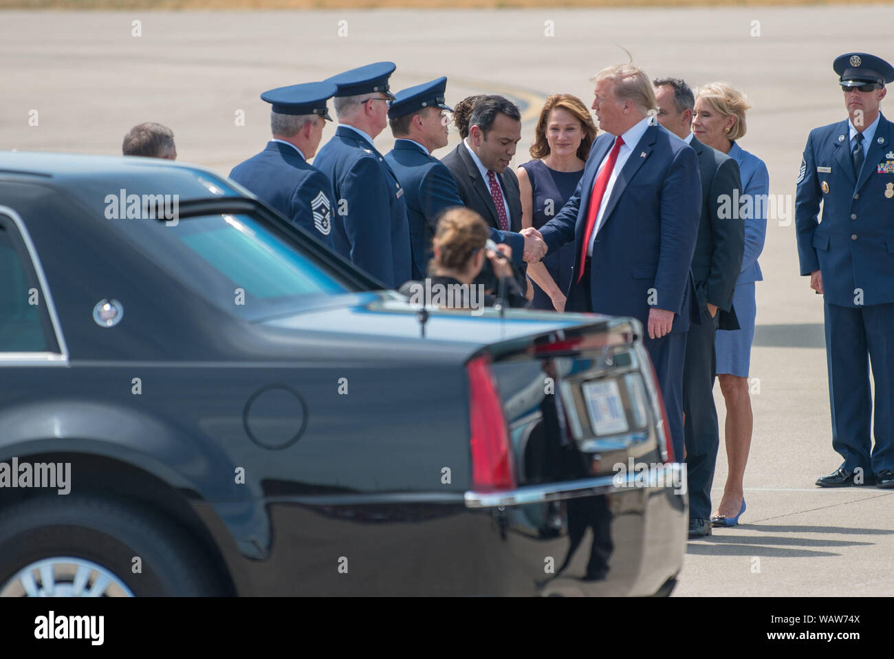 President Donald Trump greets leadership from the Kentucky Air National Guard as he arrives at the 123rd Airlift Wing in Louisville, Ky., Aug. 21, 2019. Trump was in town to speak at an AMVETS convention and attend a fundraiser for Kentucky Gov. Matt Bevin’s re-election campaign. (U.S. Air National Guard photo by Phil Speck) Stock Photo