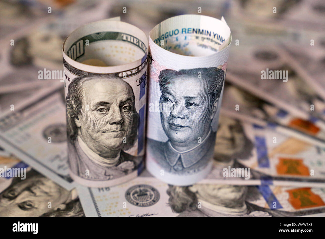US dollar and chinese yuan banknotes. Concept of trade war between the China and USA, economic, sanctions, tourism and investment Stock Photo