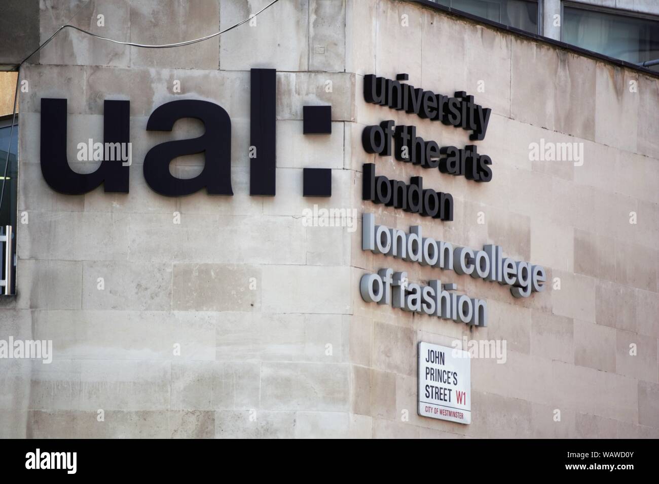 Logo of the University of the Arts and London College of Fashion on a wall of a building in Oxford Street, London, UK Stock Photo