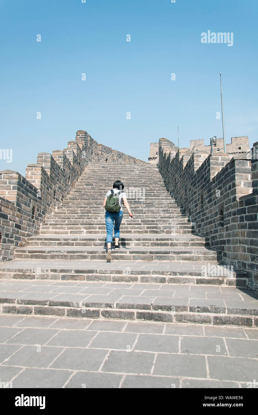A chinese woman walking up the stone steps on the great wall of china at the  huanghua cheng scenic area beijing china Stock Photo - Alamy