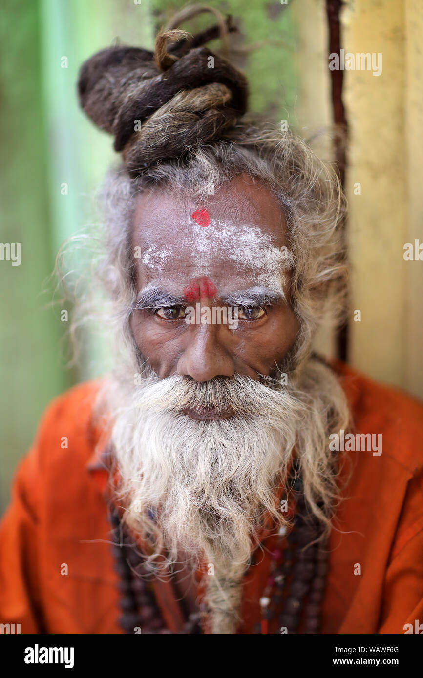 Sadhu (holy man) on the ghats of Ganges in Varanasi, India. Varanasi is the holiest of the seven sacred cities in India. Stock Photo