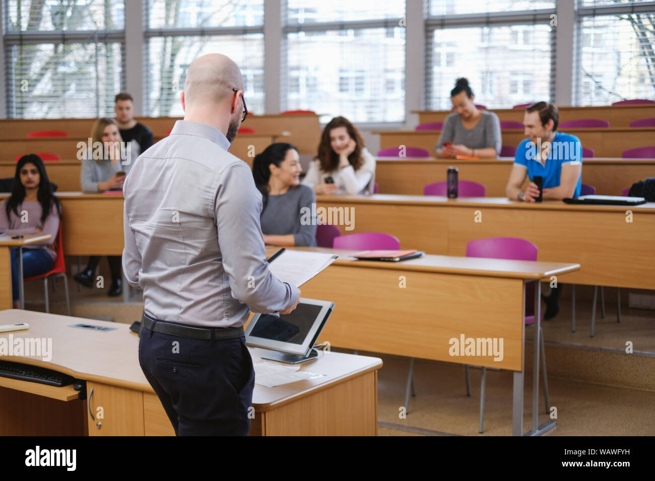 Lecturer And Multinational Group Of Students In An Auditorium