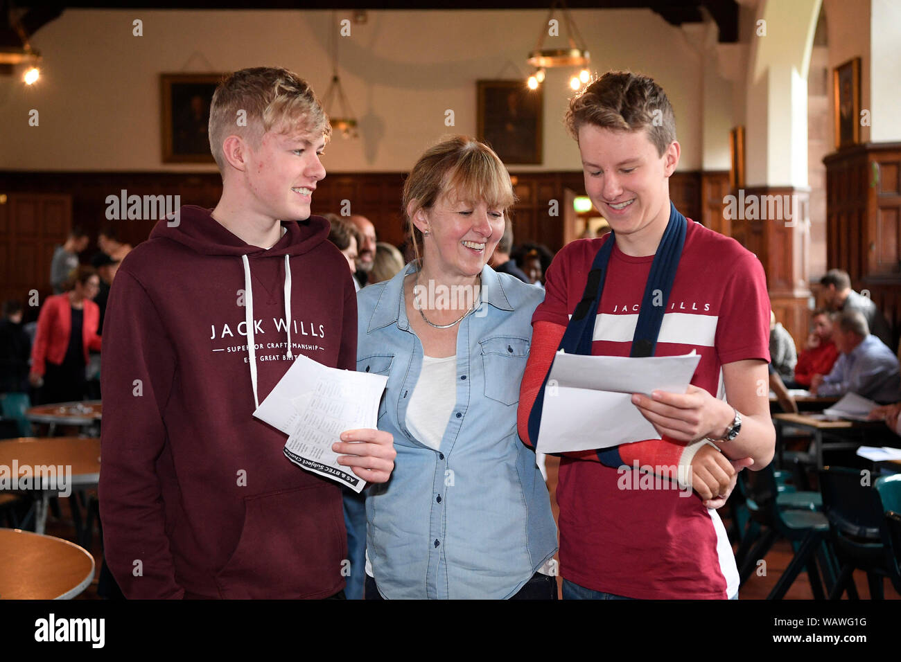 Pupils from Campbell College in East Belfast get their GCSE results.Pictured are twins Nathan (left) and Aaron Cochrane with mum, Cleone Cochrane. Stock Photo