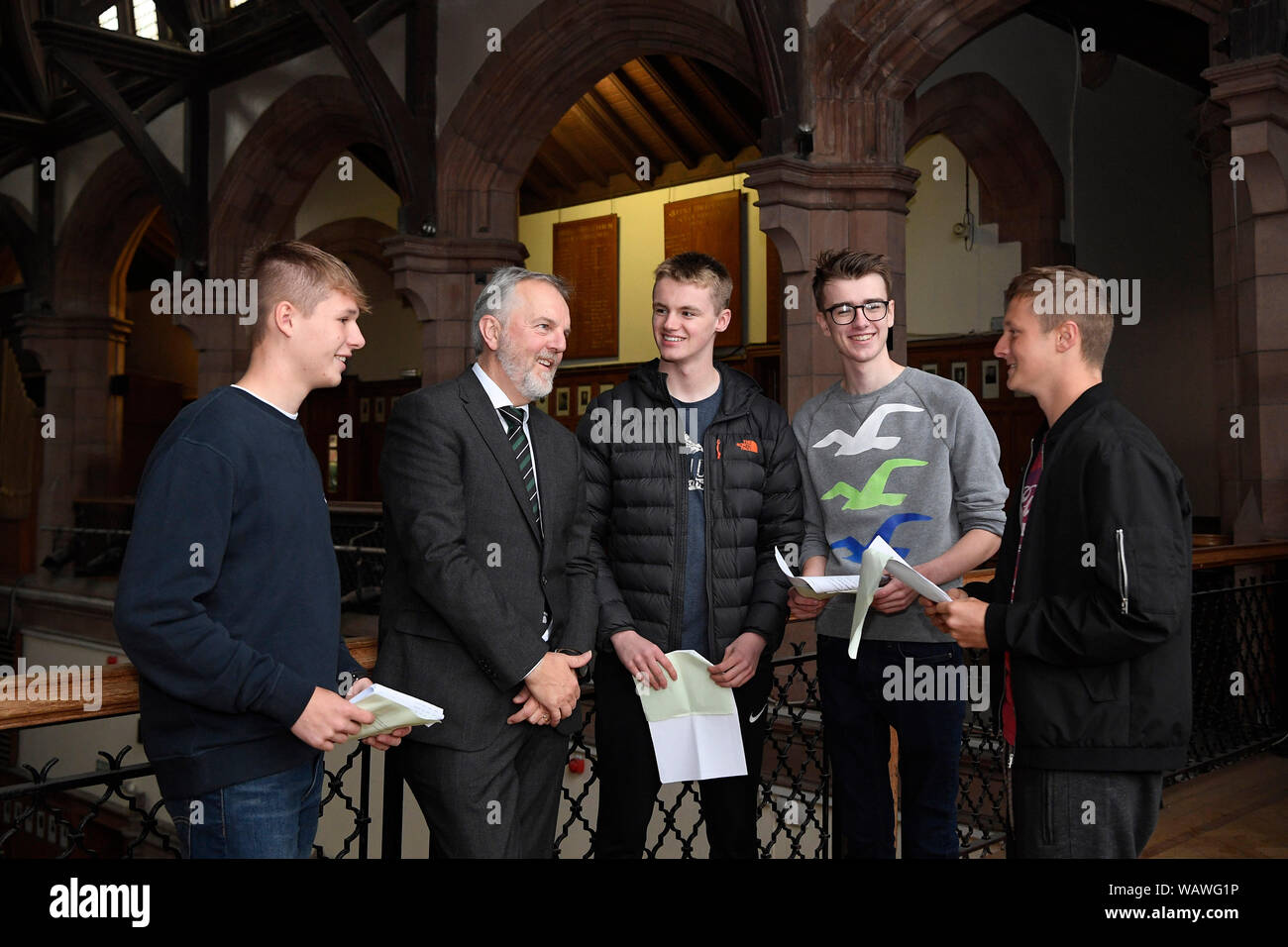 Pupils from Campbell College in East Belfast get their GCSE results. Pictured with headmaster Robert Robinson MBE are George Robinson (left), Finlay Stafford, Ben Coulter and Josh Moore (right), who all achieved 11 A* or A grades. Stock Photo