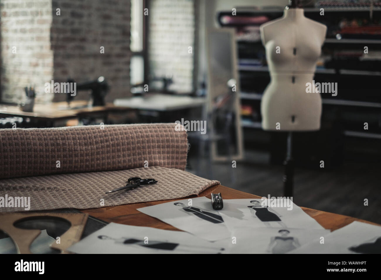 Interior of a modern tailor studio Stock Photo - Alamy