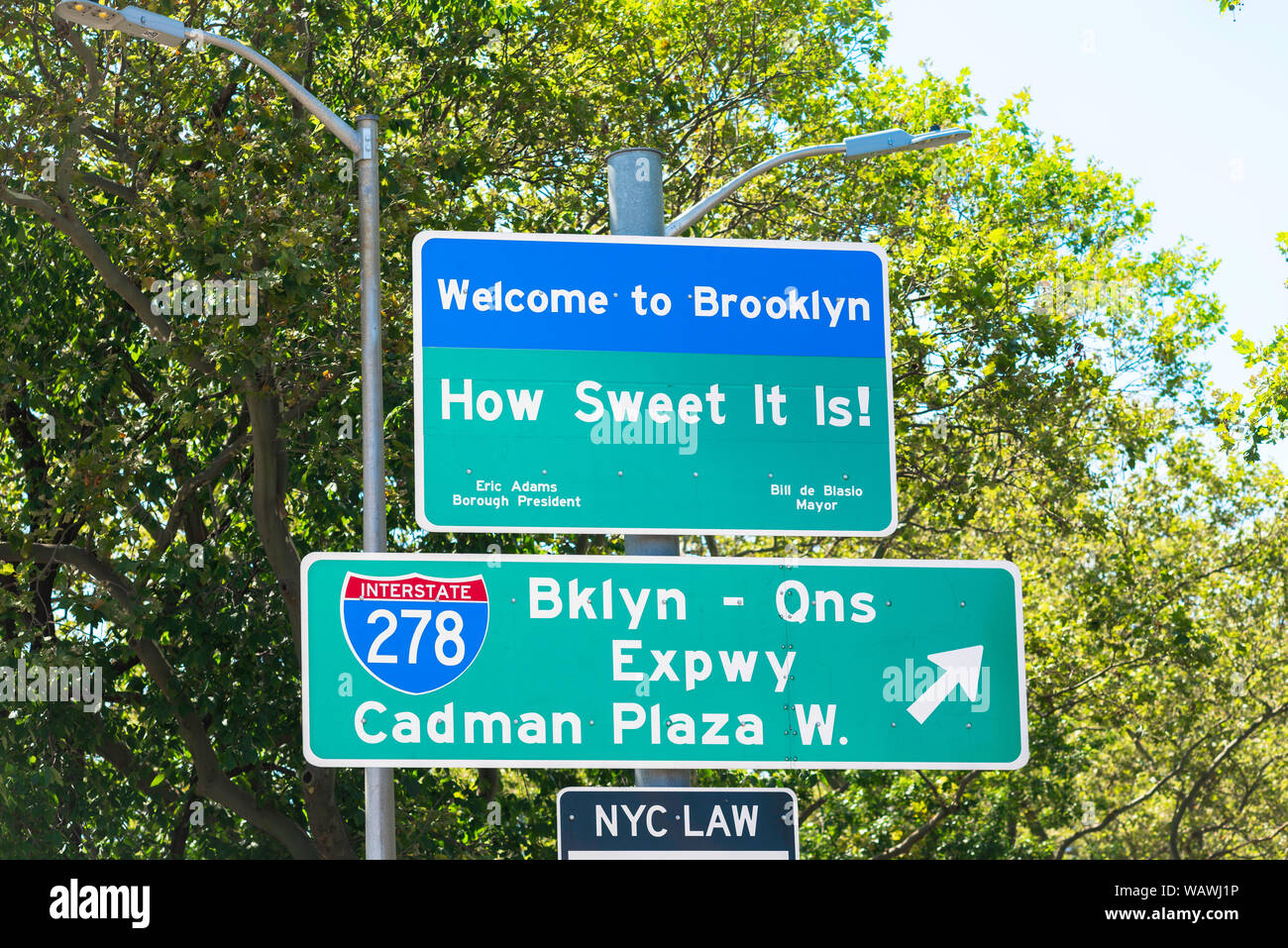 Brooklyn New York, view of a Welcome To Brooklyn sign at the eastern end of the Brooklyn Bridge, New York City, USA Stock Photo