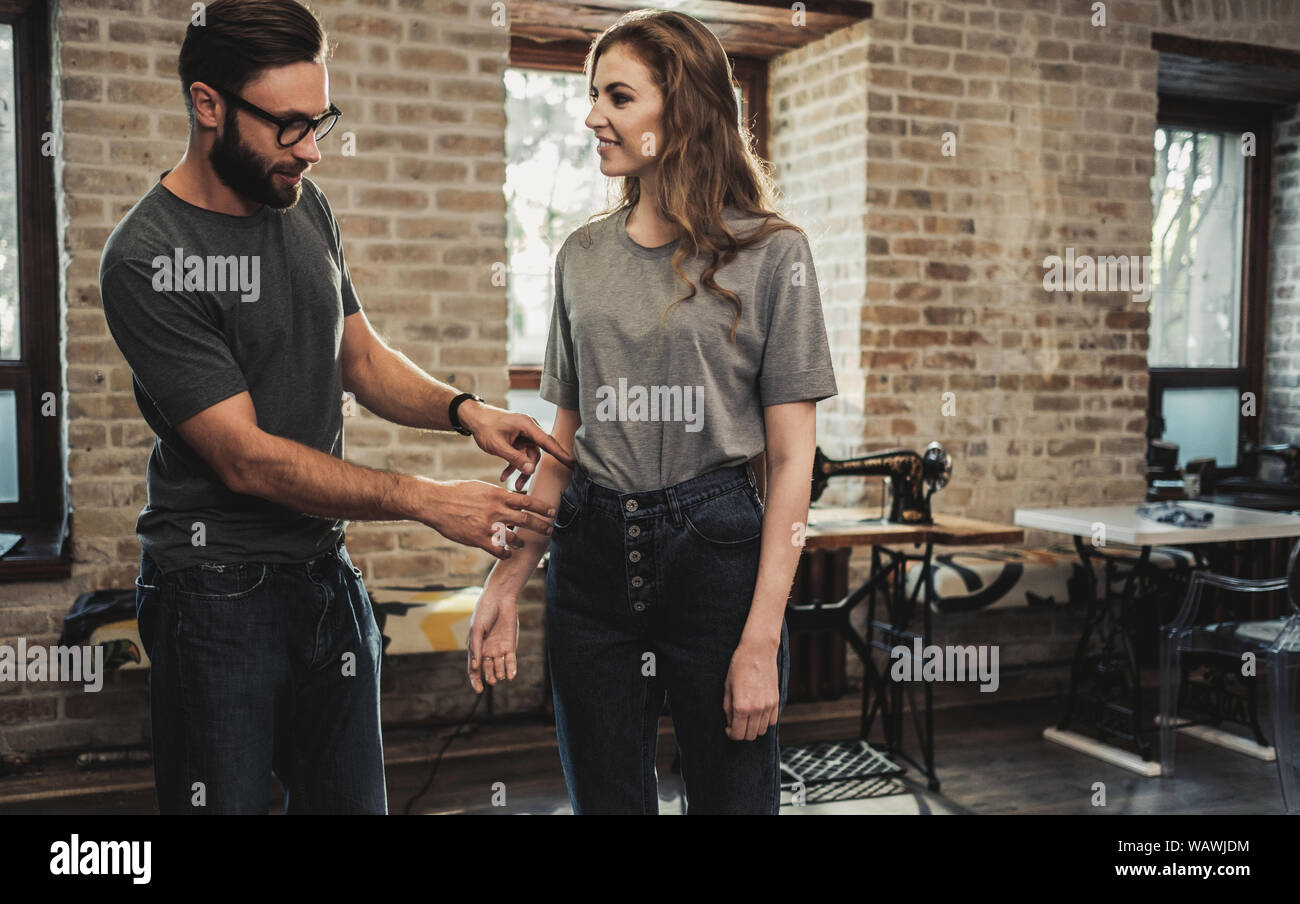 Fashion designer working in his studio Stock Photo - Alamy
