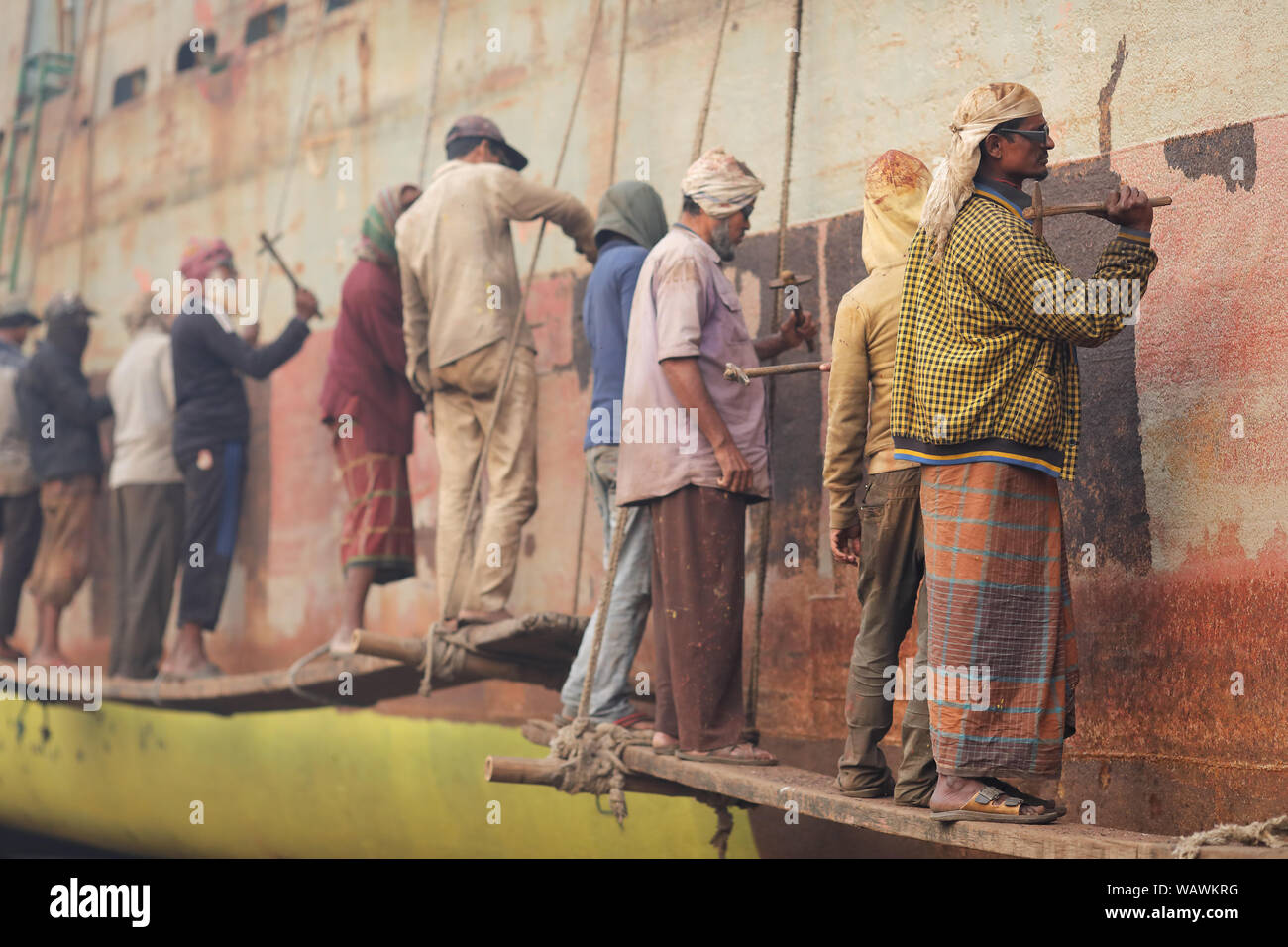 Dock workers in a shipyard in Dhaka, Bangladesh. Shipbuilding in Bangladesh has become a major industry in recent years. Stock Photo