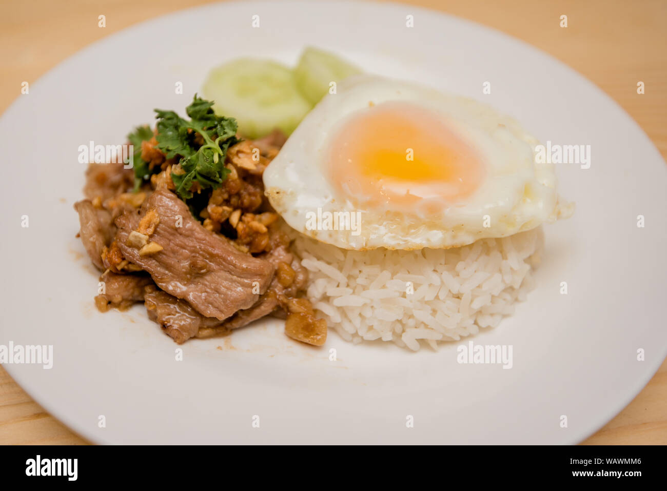 Pork fried garlic with rice and fried egg, Thai food Stock Photo